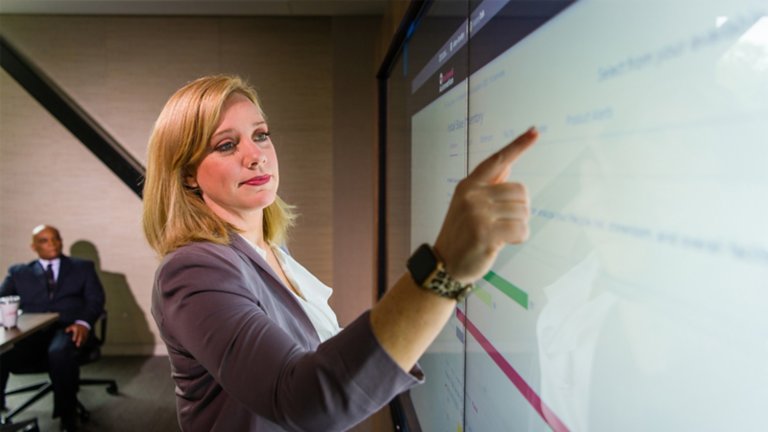 woman standing at lightboard
