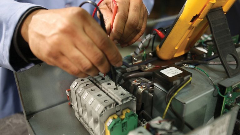 closeup of person remanufacturing equipment